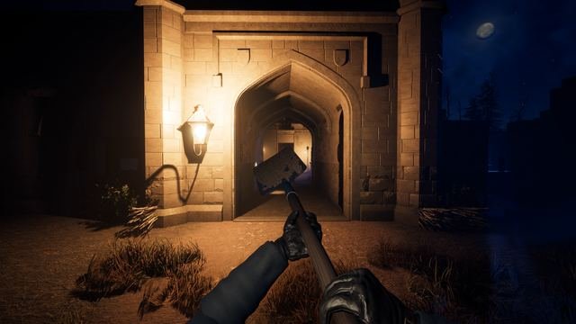 In-game, first person: shovel in hand, heading for Holloway's lamplit gatehouse arch and the way out, under the moon.